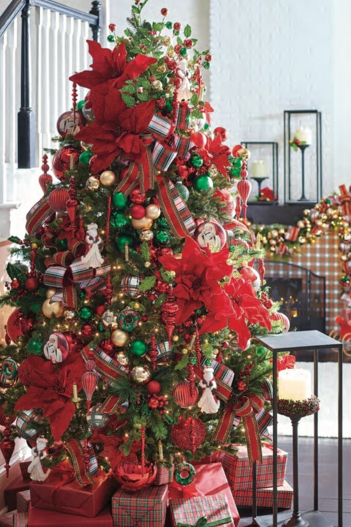 tartan tidings christmas tree, red green white plaid ribbon, rich red finials, candle lights, huge red poinsettias, emerald green and red shiny ball garlands and picks, big red bows