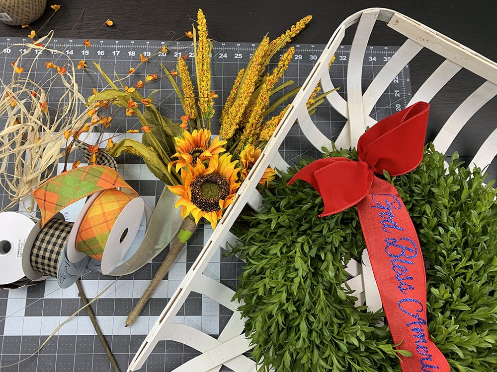 tutorial for decorating a tobacco basket for fall with sunflowers