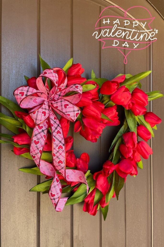 red tulip wreath on a front door