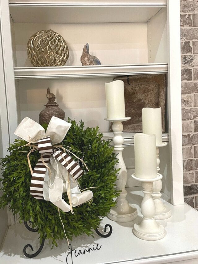 tea leaf wreath on a bookcase