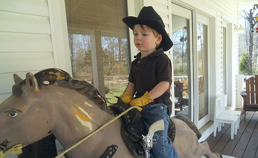 riding the mechanical horse on the back porch