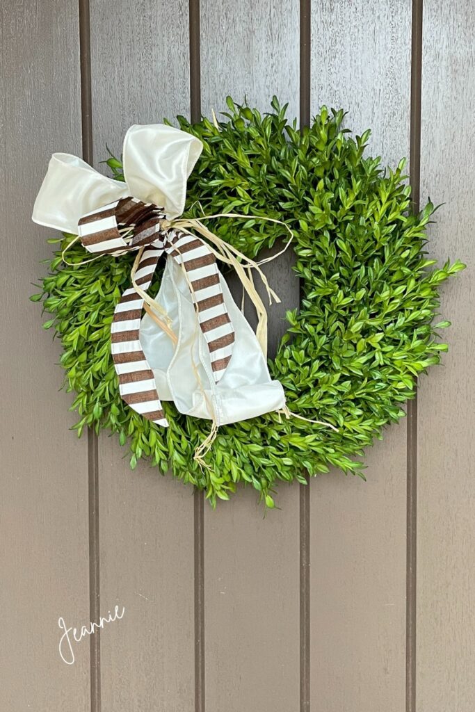 ways to display a wreath with a bow on it