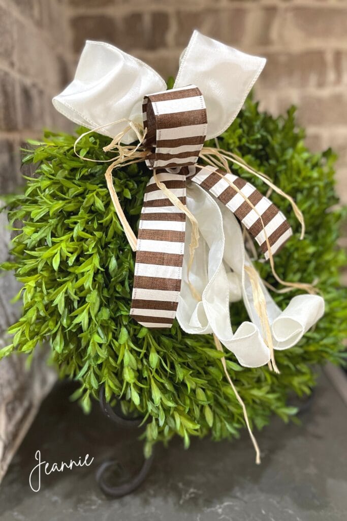 boxwood wreath, make a bow with three yards of ribbon