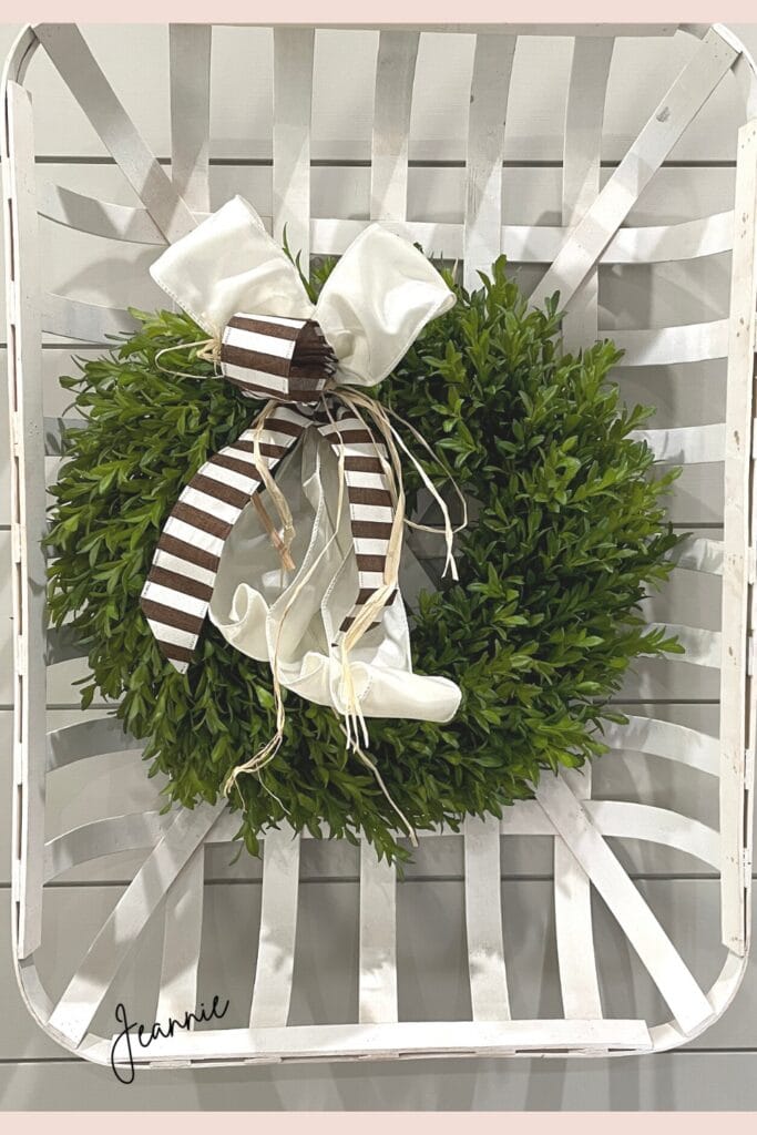 hang a boxwood wreath on the wall or inside a tobacco basket