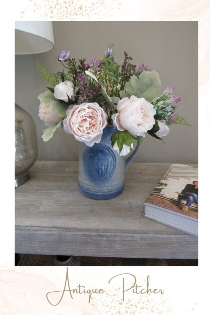 silk flowers in an old stoneware pitcher that belonged to my grandmother