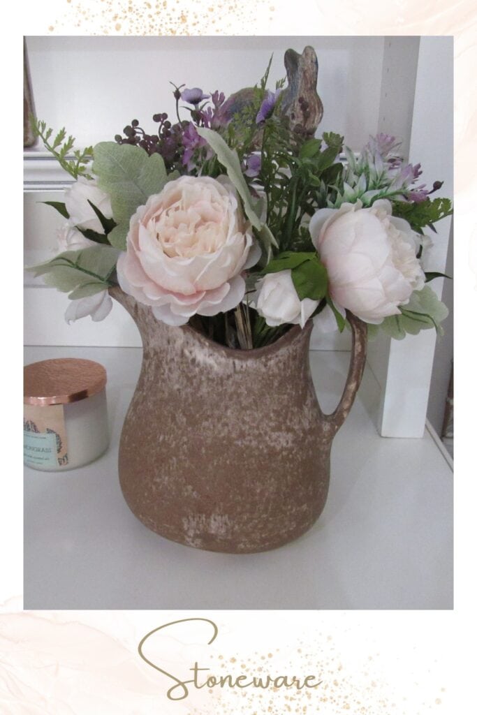 artificial flower bouquet displayed in stoneware