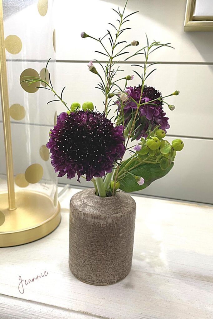 last of my fresh flowers, downsized into a small vase, purple blooms