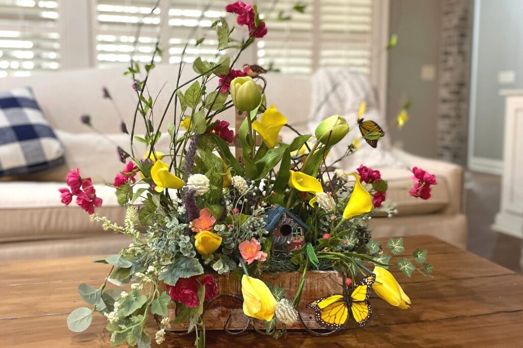 yellow butterfly pick in floral arrangement