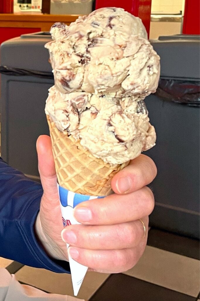 two scoops of ice cream in a waffle cone