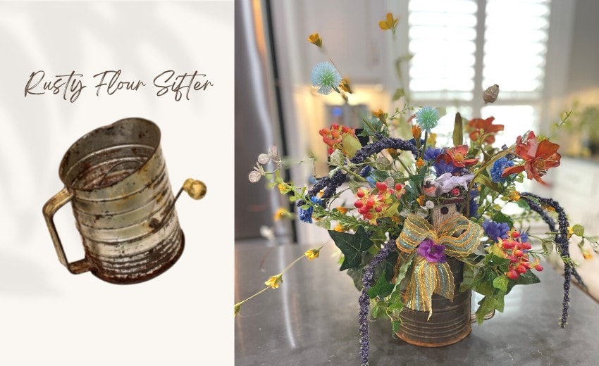 floral arrangement in an old rustic flour sifter