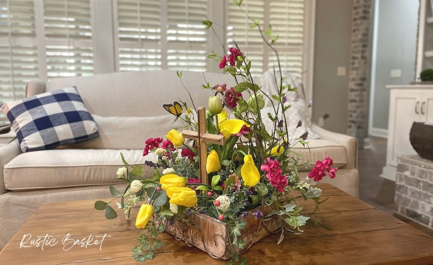 rustic basket spring floral arrangement with wooden cross