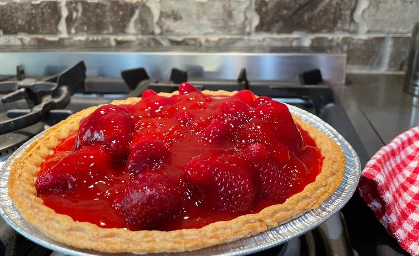 pour filling over the strawberries