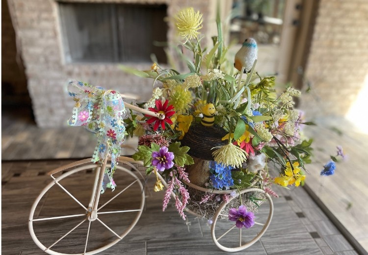 floral arrangement in a tricycle container, spring flowers