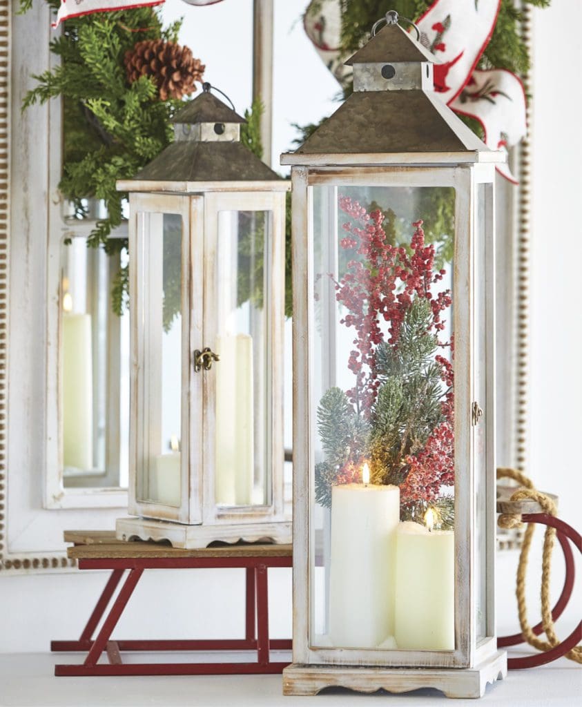 lantern decor with red berries and greenery