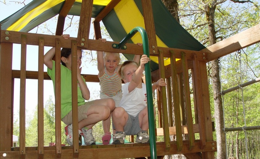 kids playing on the swing set