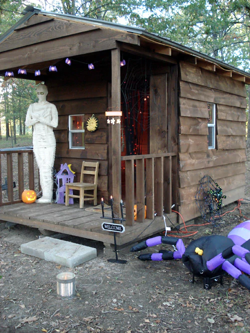 playhouse decorated for halloween, mummy and spider
