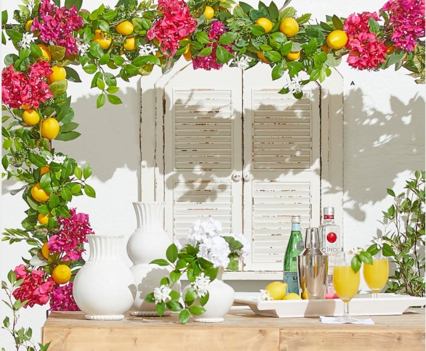 spring flowers with lemons on a backyard table on an adjustable decorative rod that attaches to a table