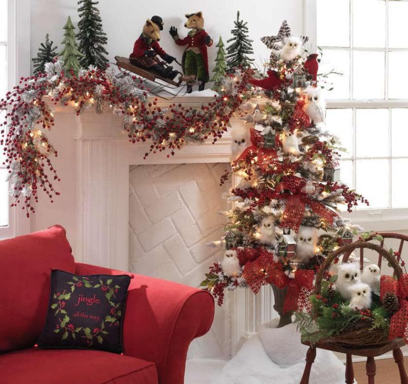 green tree with white fuzzy owls, red berries and pinecones