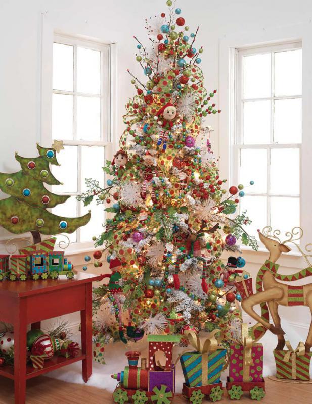 whimsical christmas tree with large packages, reindeer, ball sprays