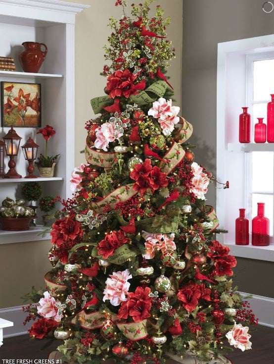 nature christmas tree with holly twig topper, white and red flowers, varigated holly and wide ribbons