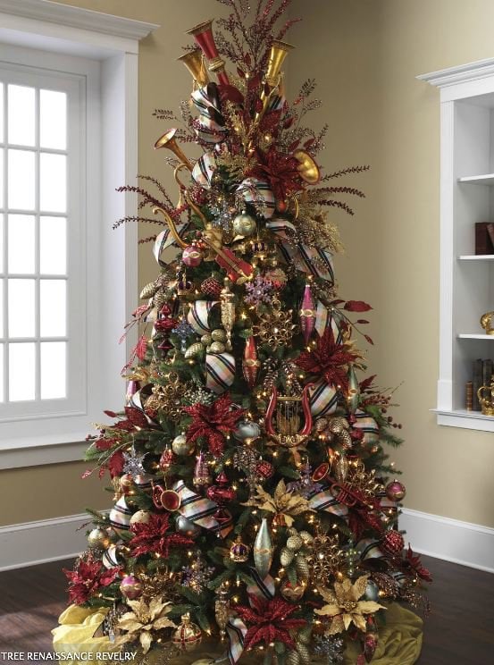 Elegant Christmas tree with huge gold and burgundy poinsettias, gold ribbons, large ornaments and lots of gold glittery sprays