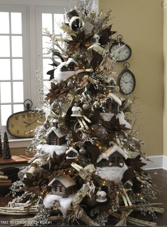 christmas tree with snow covered cabins, branch bundles, bronze a nd chocolate ornaments, snowy picks