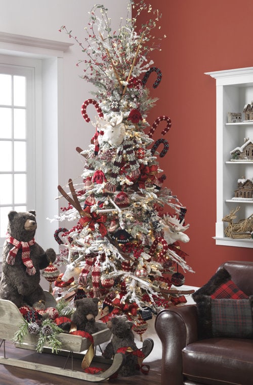 flocked tree with big bears, snow skis, knitted candy canes and balls