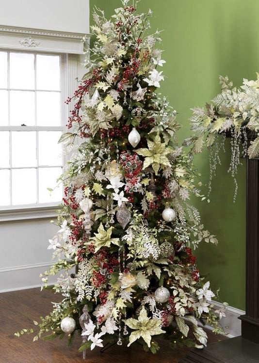 elegant christmas tree with lime green decorations, icy branches and balls, large green poinsettias and touches of red glitter