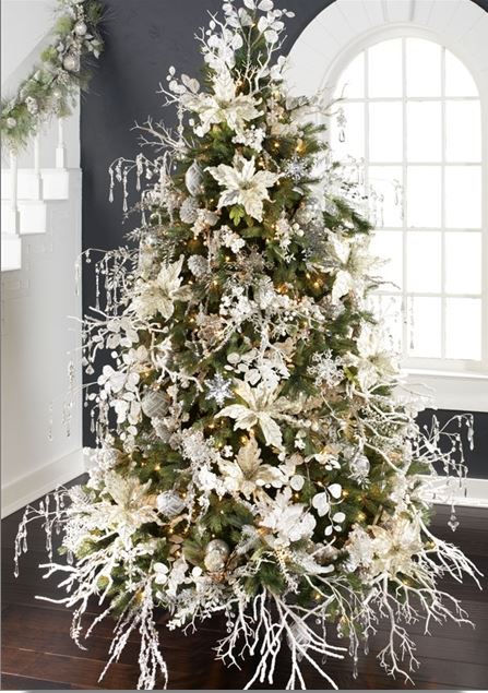 christmas tree with white poinsettias, icy branches and clear ornaments