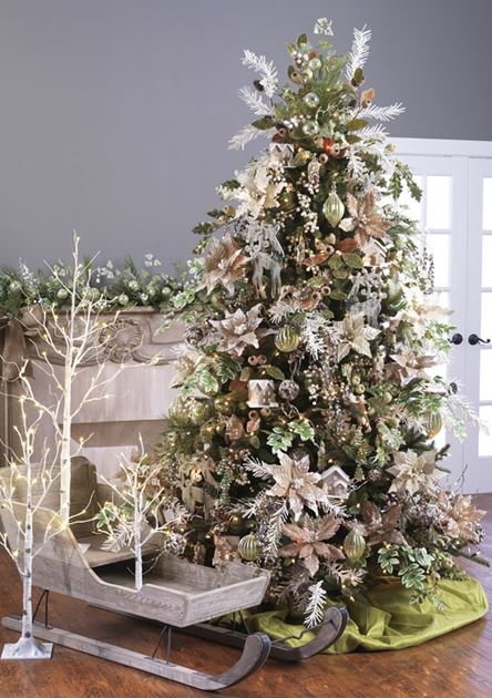 beige and bronze poinsettias, and champagne ornaments on a cottage style christmas tree, icy branches and animal ornament