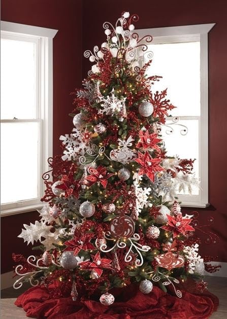 sparkling christmas tree with red, white and silver glittery decorations and swirly curly sprays