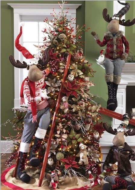 cabin style tree with animal ornaments, big moose decor, skis, berry balls and branches