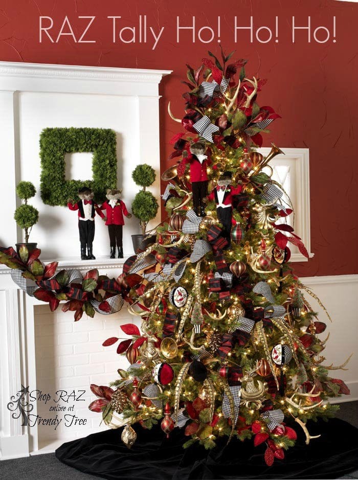 hunting style christmas tree with foxes, bugles and antler picks, black and white houndstooth ribbon, red and gold ornaments with touches of black and pheasant feather picks