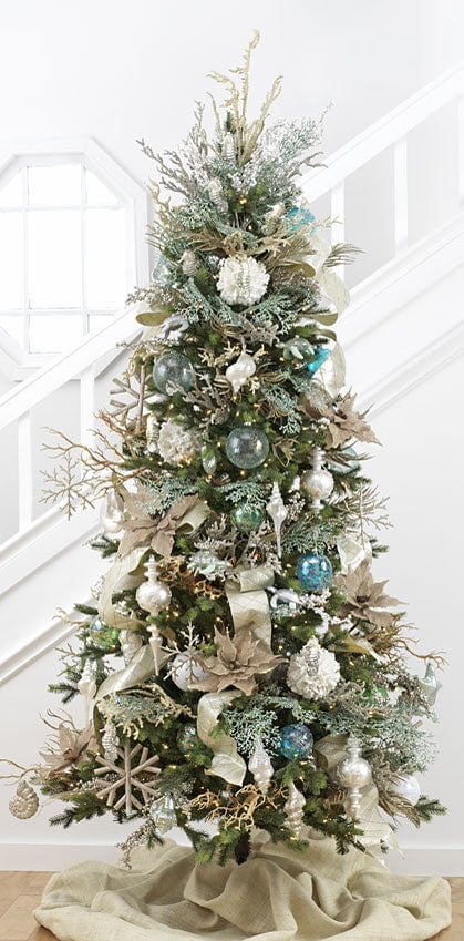 coastal or beach themed christmas tree with blue, green and cream decorations