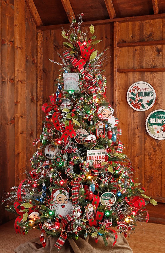 the tree lot christmas tree with old fashioned ornament, colored lights, plaid ribbon, classic santas and vintage ornaments