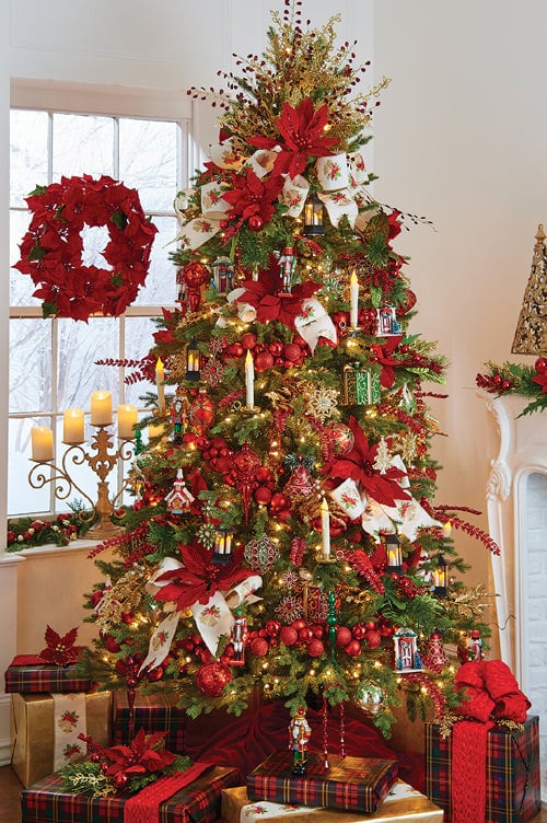 trimmed with tradition tree, red, green and gold, candle ornaments, gift package ornaments, huge red poinsettias and wide ribbon, red ball garlands.