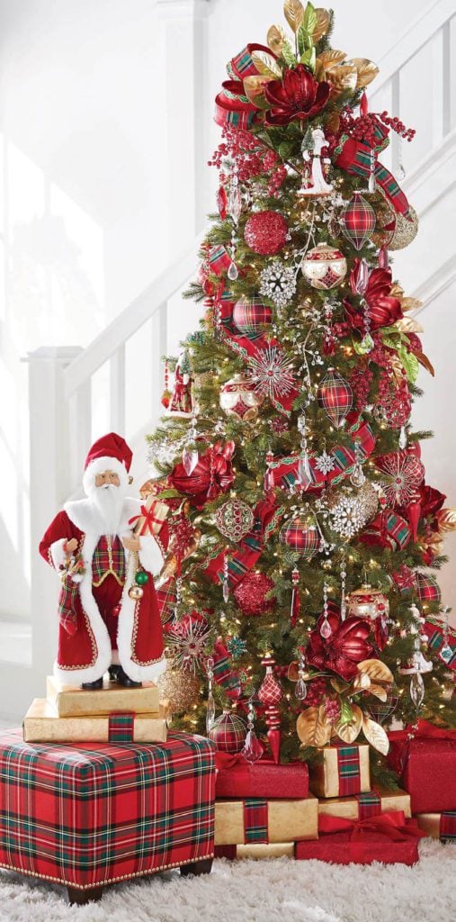 plaid tidings tree with red and green plaid, gold magnolia leaves, classic santas, red and gold finials and kismets, crystal drop ornaments, red frosted berries.