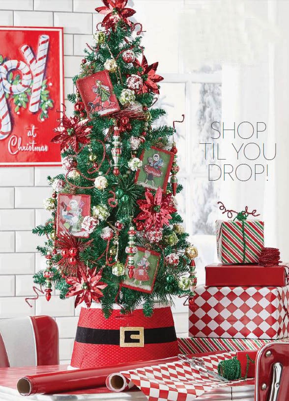nostalgic ornaments that look like old christmas books, delicate finials, red glossy poinsettias, frosted ball ornaments.