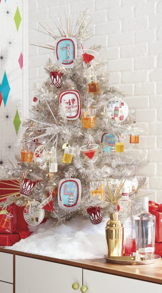 silver tinsel christmas tree with figural ornaments