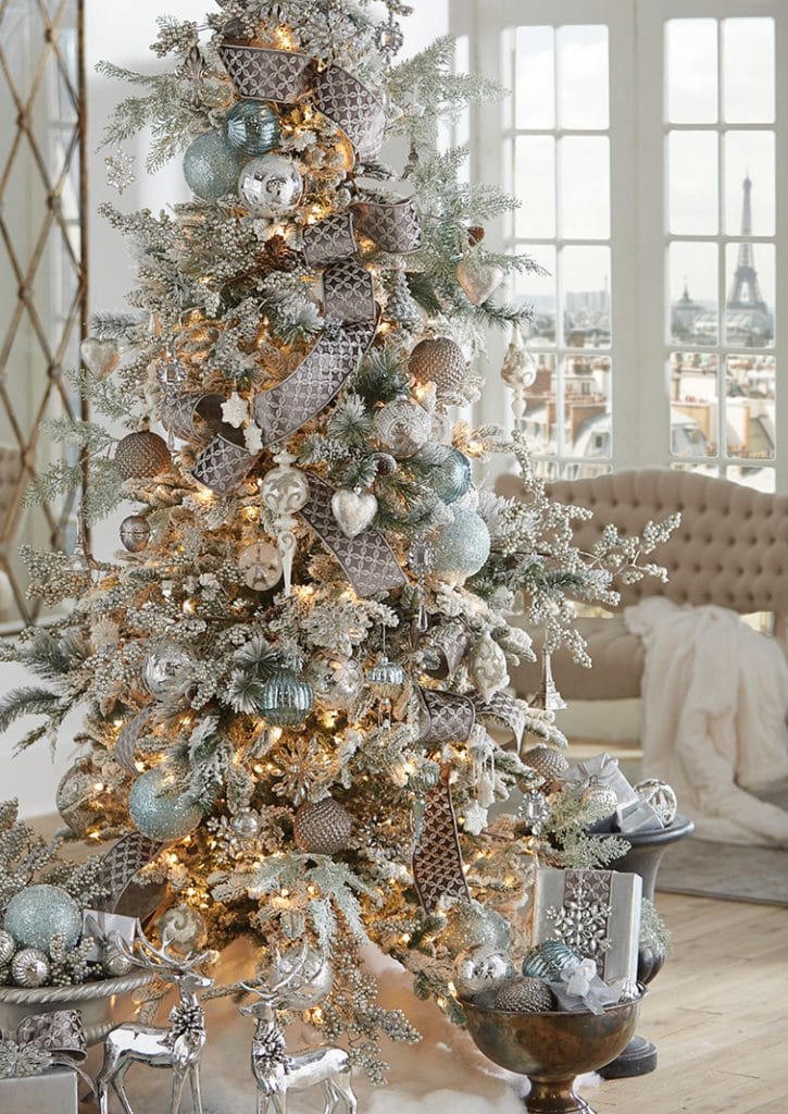 snowy tree with ice blue, white and silver ornament, icy branches and glitter ribbons