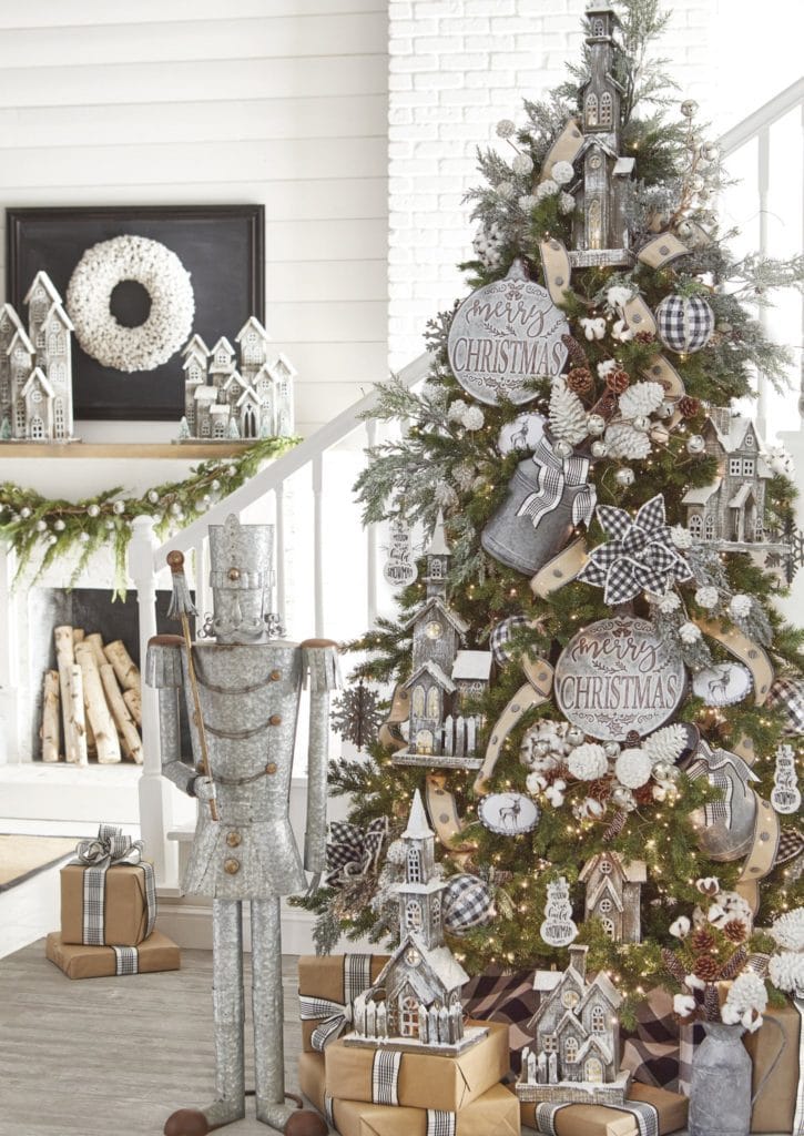 country christmas tree with wooden church ornaments, animal disks, snowy pinecones, cotton boll picks, buffalo check poinsettias, galvanized milk can, button ribbon