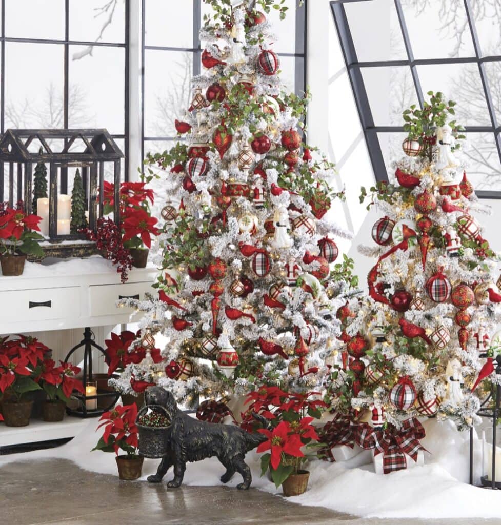 whimsical christmas tree with red bird ornaments, plaid glass balls, finials, red berry holly sprays on a white flocked tree
