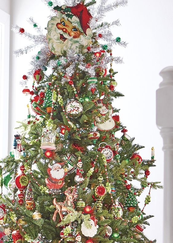 reindeer games christmas tree, silver tinsel, old fashioned santa faces, snowmen ornaments, red and green icicle ornaments, old fashioned figural ornaments, reflector ornamenets