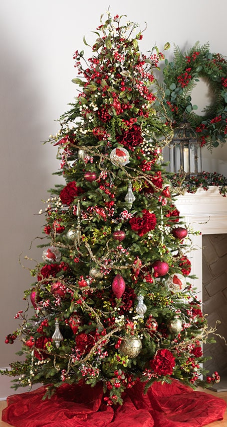 botanical garden tree with red cardinals, holly berries, holly sprays, red mums, fresh greens