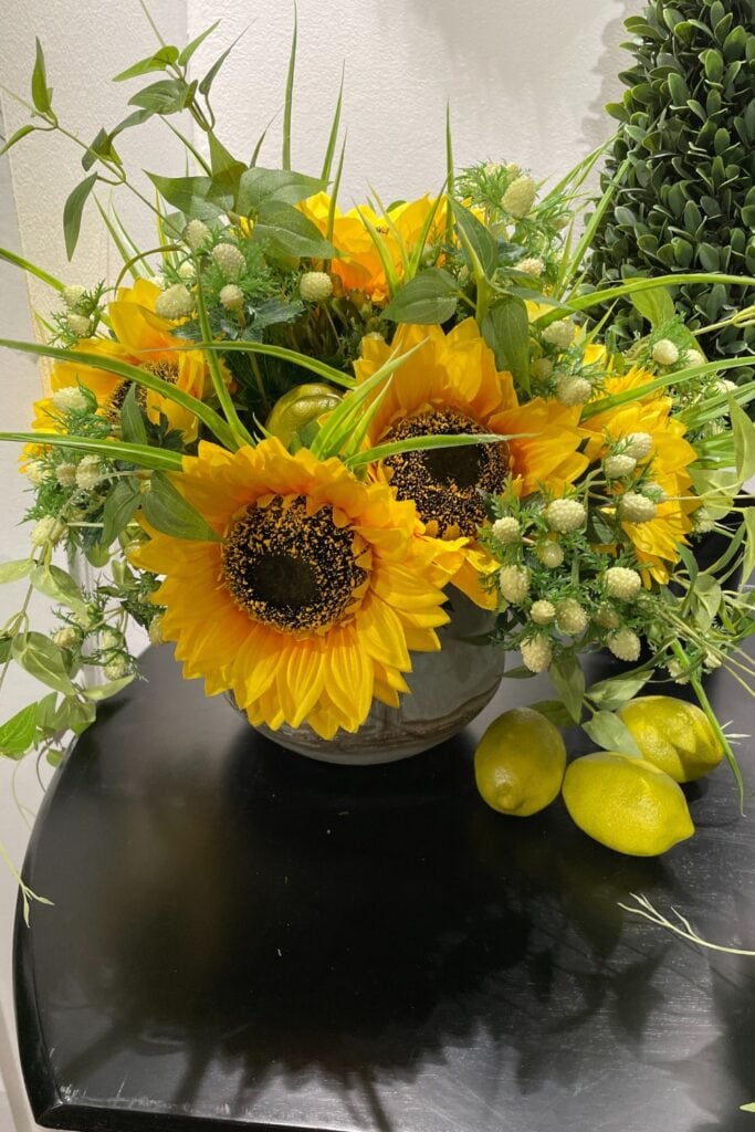 sunflowers and light green foliage for a fall floral arrangement