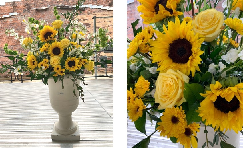 fresh yellow sunflowers, roses and mums in a pedestal pot for fall decor