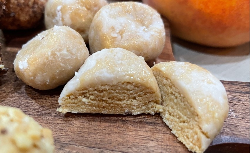 peanut butter balls rolled in confectioners' sugar