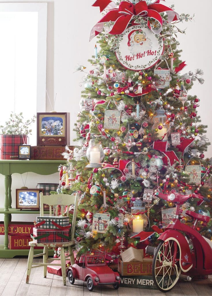 country kitchmas christmas tree - has everything but the kitchen sink, retro vintage style ornaments, multicolor glass ball garland, vintage ornaments,toys, class santa face, lantern ornaments, candle lights