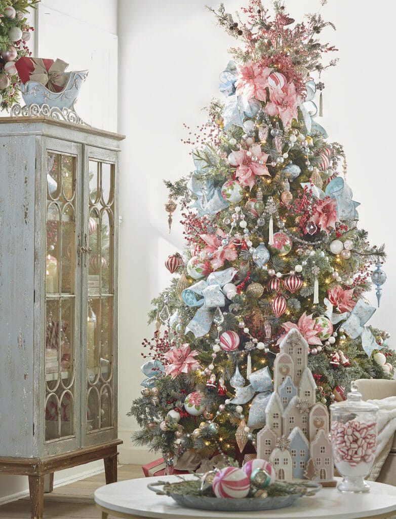 peppermint parlor tree with pale ice blue ribbons, pink poinsettias, pastel ball garland, blue finials, pink peppermint balls and pink florals