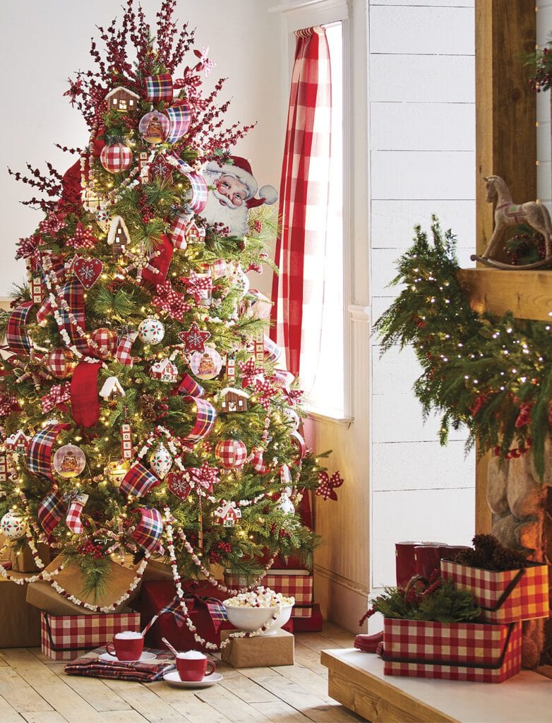 to grandmother's house we go christmas tree with old fashioned popcorn garland, red check ribbon and ornaments, vintage style ornaments, berry sprays, classic santa faces, thread spool garland